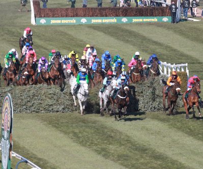 Grand National runners jumping a fence in the Aintree Grand National 2013